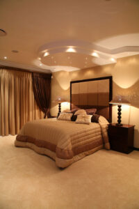 Modern bedroom with lights and side tables